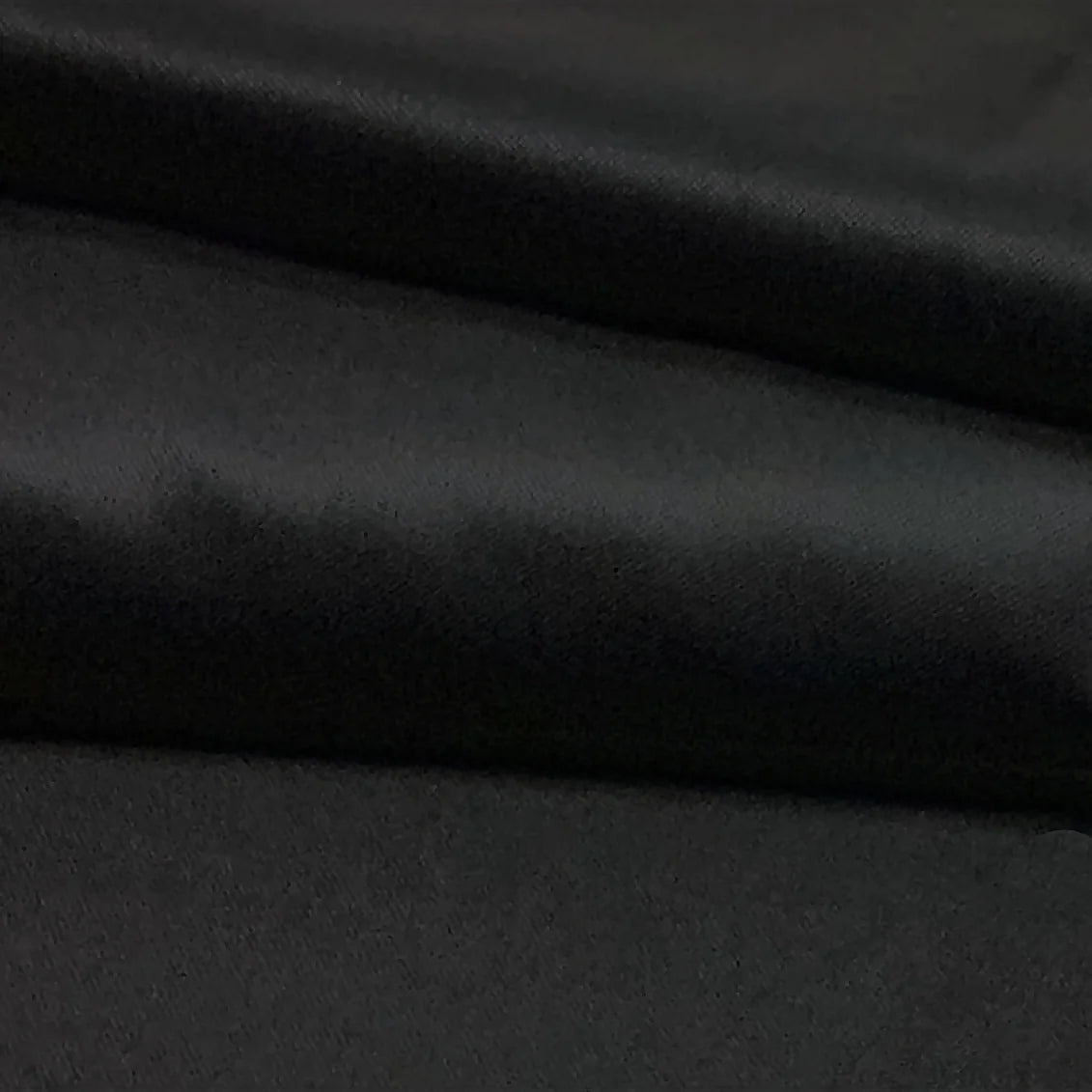 Gold Silk: black Merino and silk cloth, with light revealing its folds